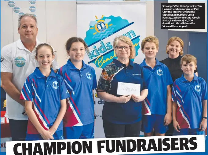  ??  ?? St Joseph's The Strand principal Tim Ham and luncheon organiser Pam Griffiths, together with school captains Eden Carfoot, Greta Ramsay, Zach Lorimer and Joseph Smith, hand over a $10,000 donation to Michelle from the Vinnies Winter Appeal.