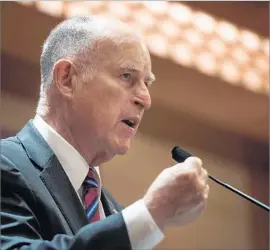  ?? Fred Dufour AFP/Getty Images ?? GOV. JERRY BROWN, shown this month in Beijing, supports a “trailer bill” that would protect a freshman Democratic senator from a Republican-led recall effort.