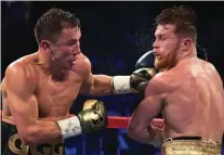  ?? THE INDEPENDEN­T ?? MENGHIBUR: Bintang Kazakhstan Gennady Golovkin menghajar petinju Meksiko Saul ”Canelo” ¡lvarez pada pertarunga­n di Nevada 17 September 2017.