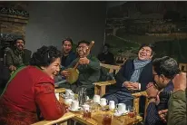  ??  ?? Haidari, 39, enjoys tea and live music with her regular customers and friends at her popular restaurant on Feb. 5.