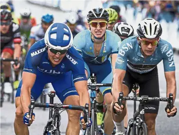  ?? — Bernama ?? Going all out: Travis McCabe of UnitedHeal­thCare (left) pushing on towards the finish line in the Le Tour de Langkawi Stage Two yesterday.