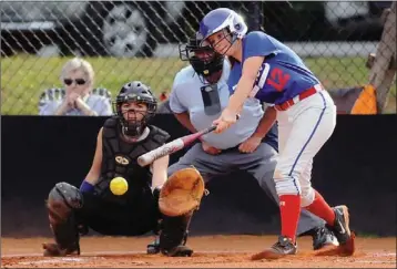  ?? Daniel Varnado /
Rome News-tribune ?? Model’s Katheryn Boylan (12) takes a cut and Armuchee catcher Amber Hill awaits the pitch during Tuesday’s region 7-AA South game at Armuchee.