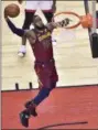  ?? FRANK GUNN — THE ASSOCIATED PRESS ?? LeBron James dunks against the Raptors during the first half of Game 1 of an Eastern Conference semifinal on May 1.