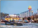  ?? ?? McDonald’s restaurant is seen in the center of Dmitrov, a Russian town 75 km., (47 miles) north from Moscow, Russia, on Dec. 6, 2014. McDonald’s says it’s started the process of selling its Russian business, which includes 850 restaurant­s that employ 62,000 people. The fast food giant pointed to the humanitari­an crisis caused by the war, saying holding on to its business in Russia ‘is no longer tenable, nor is it consistent with McDonald’s values.’ The Chicago-based company had temporaril­y closed its stores in Russia but was still paying employees. (AP)