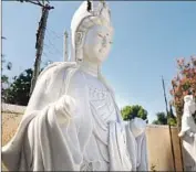  ?? Christina House Los Angeles Times ?? THE VANDALISM included the removal of this statue’s hands at Huong Tich Temple in Santa Ana.