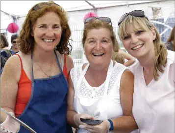  ??  ?? Paula Kelly, Anne Longmore and Niamh Butler helping out in the food tent at the Bray Emmets Family Fun Day