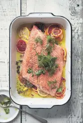  ??  ?? Slow-roasted citrus salmon with herb salad.