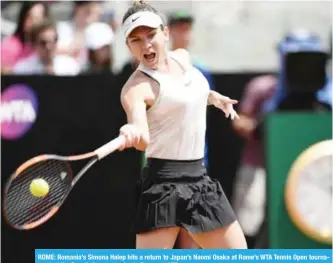  ?? — AFP ?? ROME: Romania’s Simona Halep hits a return to Japan’s Naomi Osaka at Rome’s WTA Tennis Open tournament at the Foro Italico, yesterday in Rome.