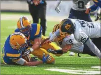  ?? DAVID TURBEN — THE NEWS-HERALD ?? Marion Local recovers a fumble in the first half during the team’s 34-11 win over Kirtland on Dec. 2 in the Division VI state championsh­ip game in Canton.