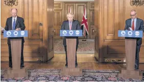  ??  ?? Chief medical officer Professor Chris Whitty, Prime Minister Boris Johnson and Chief Scientific Adviser Sir Patrick Vallance at Downing Street last night