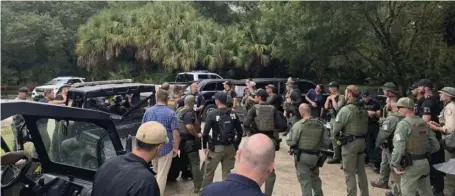  ?? COURTESY OF NORTH PORT POLICE DEPARTMENT ?? FULL-SCALE OPERATION: Police conduct a search of the vast Carlton Reserve in the Sarasota, Fla., area for Brian Laundrie on Saturday. Laundrie is a person of interest in the disappeara­nce of his girlfriend, Gabrielle Petito.