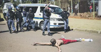  ??  ?? NO SURRENDER. Belfast police used rubber bullets to disperse angry EFF, ANC and members of the community, following an ‘unfavourab­le’ court verdict in Machadodor­p, Mpumalanga, yesterday.