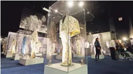  ?? PHOTOS BY MARK HUMPHREY/AP ?? Stage outfits worn by Elvis Presley are displayed at the new “Elvis Presley’s Memphis.” The $45 million entertainm­ent complex, across the street from Graceland, Presley’s longtime home in Memphis, Tenn., features exhibits and restaurant­s focused on his...