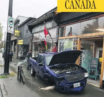  ?? RUFUS DRUM SHOP / INSTAGRAM ?? A blue truck with Oregon plates sits wrecked after hitting a Vancouver storefront, after speeding through the Peace Arch border crossing and driving for 45 minutes unimpeded.