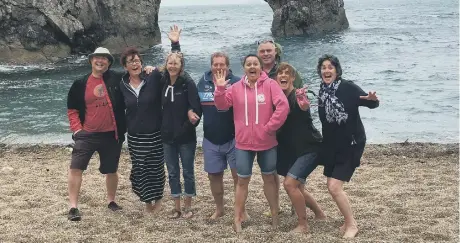  ??  ?? Nicola Guise is pictured with her fellow swimmers at Brownsea Island