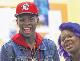  ??  ?? Freemonta Strong (left), 17, attends a meeting of youth organizers at Teen Empowermen­t in Rochester, N.Y. The organizers lead discussion­s with police recruits and plan block parties.