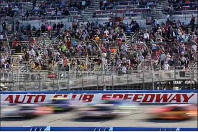  ?? JAMES GILBERT — GETTY IMAGES/ TNS ?? Fans watch the NASCAR Cup Series Wise Power 400 on Feb. 27, 2022, at Auto Club Speedway in Fontana, Calif.