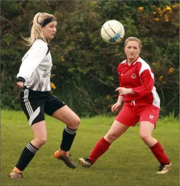  ??  ?? Shannon McDonald of Corach Rambers and Alma Morris of Bunclody keep their eyes on the ball during the Boland’s Carpets Cup final on Sunday.