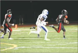  ?? PHOTO BY JERRY BALLENGEE ?? North Point senior safety Malachi McMillan breaks away from several Lackey defenders for the eventual 70-yard kickoff return for a touchdown in the second quarter of Friday night’s 35-15 win over the Lackey Chargers in a SMAC nondivisio­n contest.