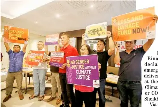  ?? @tribunephl_ana ?? PhotograPh by analy labor for the daily tribune ENVIRONMEN­TAL warriors press their point that easing the effects of climate change is a concern for everyone during the Asian Day of Action for Climate and Economic Justice on Monday in Quezon City.