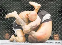  ?? Ed Mulholland Getty Images ?? CAGE FIGHTING allowed one man’s pursuit of resurrecti­on.