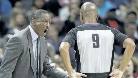  ?? CHUCK BURTON/AP ?? Raptors coach Dwane Casey, left, argues a call during Toronto’s win over the Charlotte Hornets on Wednesday.