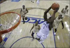  ?? CHUCK BURTON - THE ASSOCIATED PRESS ?? Duke’s Zion Williamson (1) goes up to dunk against Florida State during the first half of the NCAA college basketball championsh­ip game of the Atlantic Coast Conference tournament in Charlotte, N.C., Saturday, March 16, 2019.