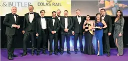  ?? PAUL BIGLAND/ RAIL. ?? The teams behind the Balfour Beatty, Dyer &amp; Butler Ltd and Colas Rail joint venture collected the Safety Initiative of the Year award for their Close Call App, from BBC News anchor Huw Edwards (far left) and NRA Stage Assistant Gabriella Lester (far right).