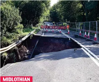  ??  ?? Mind the gap: Massive crater on A6 near Fala made the road impassable MIDLOTHIAN