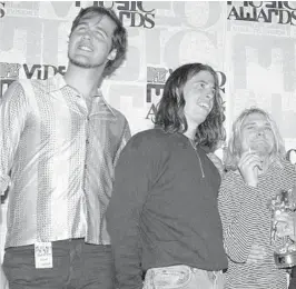  ?? MARK J. TERRILL/AP ?? Nirvana band members Krist Novoselic, from left, Dave Grohl and Kurt Cobain at the MTV Video Music Awards on Sept. 2, 1993.