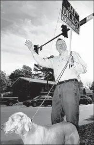  ?? Democrat-Gazette file photo ?? Then-U.S. Rep. Jay Dickey, a Republican, campaigned with his dog, Romy, in his hometown of Pine Bluff on Election Day in November 2000. Dickey lost to Mike Ross, a Democrat, that year and again in a comeback attempt two years later.