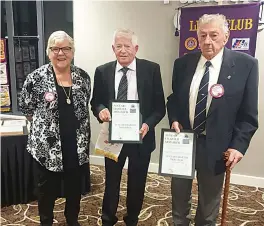  ?? ?? Drouin Lions Club president Erika Wassenberg presents Graham Austin and Maurie Kilmartin with 50 year Charter Awards.
