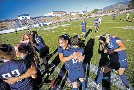  ?? PHOTOS BY LUIS SÁNCHEZ SATURNO/THE NEW MEXICAN ?? Santa Fe Prep celebrates their win over St. Michael’s on Monday. With the victory, the Blue Griffins won their district’s title for the first time in 12 years. Prep is also the only remaining unbeaten girls soccer team in the state.
