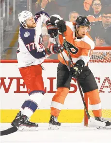  ?? BRUCE BENNETT/GETTY IMAGES ?? The Flyers’ Ivan Provorov and the Blue Jackets’ Josh Anderson battle in the crease Thursday night at the Wells Fargo Center in Philadelph­ia.