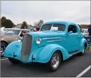  ??  ?? Who needs blue skies when Bernville residents Mike and Ann Krigas’ 1936Chevy street rod is on the lot?