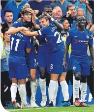  ??  ?? Chelsea players celebrate Marco Alonso’s goal