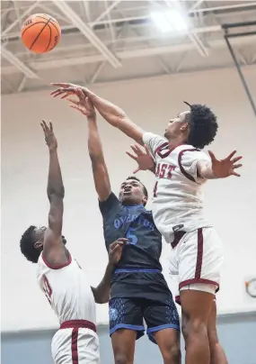  ?? STU BOYD II/THE COMMERCIAL APPEAL ?? Overton’s Jordan Frison attempts a shot against East High during the March 2 Regional 8-4A championsh­ip game.