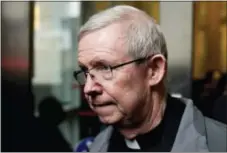  ?? ASSOCIATED PRESS ?? In this Jan. 6, 2014, file photo, Monsignor William Lynn leaves a bail hearing at the Center for Criminal Justice in Philadelph­ia. A judge ruled Friday that the prosecutio­n can retry Lynn, long imprisoned over his handling of abuse complaints.