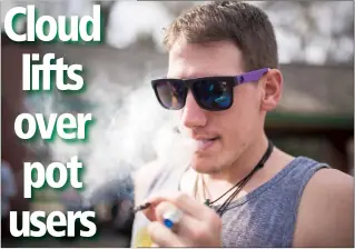  ?? Herald photo by Tijana Martin ?? Tim Robinson smokes marijuana during the 4/20 at the Park event at Galt Gardens on Thursday. @TMartinHer­ald