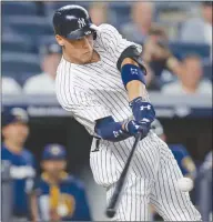  ?? The Associated Press ?? New York Yankees slugger Aaron Judge hits a fifth-inning solo home run against the Milwaukee Brewers in New York on Friday.