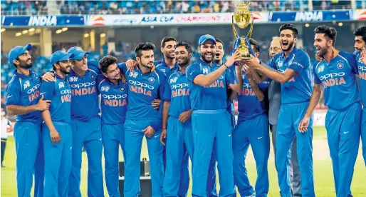 ?? Photos by Neeraj Murali ?? Indian players celebrate their seventh Asia Cup title victory after beating Bangladesh in the final in Dubai on Friday night. —