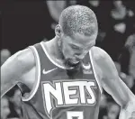  ?? AP; N.Y. Post: Charles Wenzelberg ?? OUCH: Rather than celebrate a championsh­ip alongside Stephen Curry as he did in 2017 and 2018, Kevin Durant’s Nets were swept out of the playoffs in the first round, while the Warriors are one victory from another title.