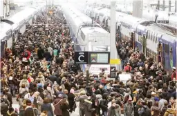  ??  ?? RAIL STRIKE IN FRANCE – Commuters are seen on a crowded platform of the Gare de Lyon railway station on April 3, 2018 in Paris, on the first day of a two days strike. Staff at state rail operator SNCF walked out of the job from 7 p.m. (1700 GMT) on...
