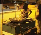  ?? ROSEMARIE COUNTER ?? A street vendor sells balut, or boiled duck embryo, in Manila, Philippine­s. Travel writer Rosemary Counter rates the ick factor 10 out of 10.