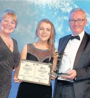  ?? HUW JOHN / SARAH BARNES PHOTOGRAPH­Y ?? Tyler Payne, a student at the University of South Wales, winning her RCN Wales Student Nurse of the Year award 2017