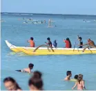  ?? JEWEL SAMAD/GETTY IMAGES ?? Toting surfboards suitable for Waikiki beach will cost you $75 on Southwest.