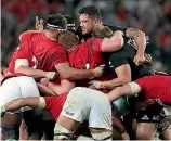  ??  ?? Wyatt Crockett, the nearest All Black to the camera, makes mincemeat of Lions tighthead prop Tadgh Furlong.