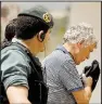  ?? AP/ FRANCISCO SECO ?? Angel Maria Villar ( right), the former president of the Spanish Football Federation, is led by Spanish Civil Guard police officers Tuesday as they enter the Federation headquarte­rs in Las Rozas, Spain. Villar, FIFA’s senior vice president, was...