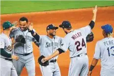  ?? AFP ?? Robinson Cano (centre) celebrates with American League teammates after they defeated the National League 2-1 during the 88th MLB All-Star Game in Miami, Florida, on Tuesday.