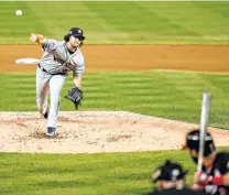  ?? Geoff Burke / Getty Images ?? Astros starter Gerrit Cole worked seven innings Sunday, allowing just one run and three hits and striking out nine.
